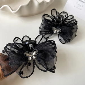 Elegant black polka dot mesh bow hair claw clip with sparkling rhinestone butterfly decor