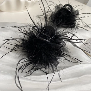 Elegant black ostrich feather hair claw clip with mesh detail for autumn hairstyles