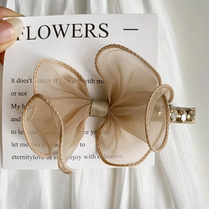 Elegant champagne lace bow hair clip with sparkling rhinestones and mesh texture