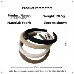 Close-up of padded fabric headbands with quilted texture in black, beige, and brown colors