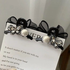 Set of two black mesh bow hair claws with sparkling rhinestones and white pearls