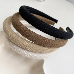Quilted fabric padded headbands set in black, brown, beige, and white colors