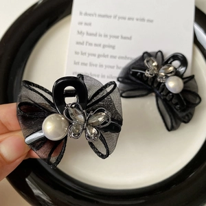 Elegant black mesh bow hair clip with rhinestone butterfly and pearl detail