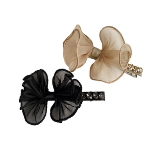 Elegant champagne and black lace bow hair clips with sparkling rhinestone detailing