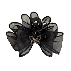 Pince à cheveux élégante noire en tulle avec nœud et décoration papillon brillante