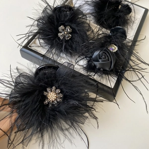 Set of four black feather hair clips with satin roses, mesh, and sparkling rhinestones