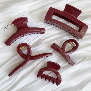 Five-piece set of premium burgundy red hair claws in various glossy minimalist shapes