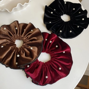 Oversized velvet scrunchies set with pearl embellishments in wine red, coffee, and black