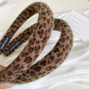 Handmade leopard print plush headband with vintage furry texture for autumn and winter