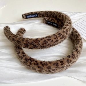 Vintage leopard print plush headband with soft faux fur and handmade woven label