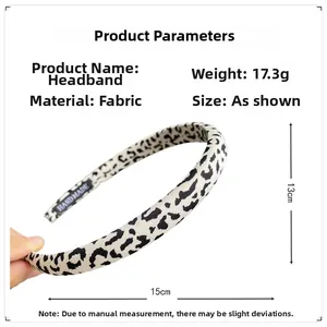 Detailed size and weight specs for the leopard print fabric headband featuring handmade tag