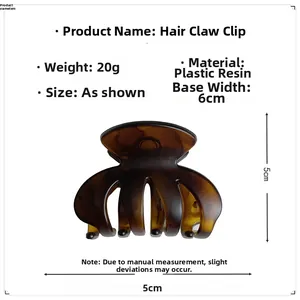 Detail view of a medium dark brown tortoiseshell hair claw showing its 6cm x 5cm dimensions