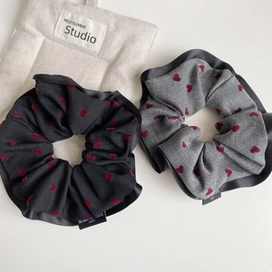 Retro heart print scrunchies with black satin trim and minimalist vintage design