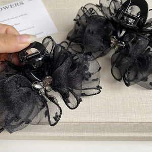 Elegant black polka dot mesh claw clip with rhinestone butterfly detail for women