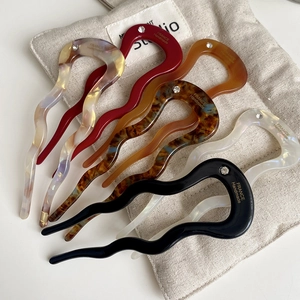 Detailed set of six acetate U-shaped wavy hair pins in various colors with small crystal