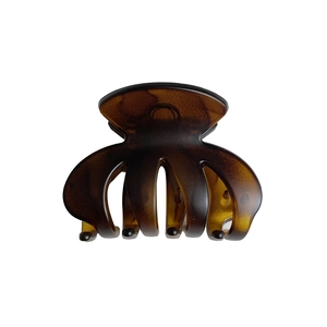 Matte tortoiseshell shark hair claw clip in amber and brown for elegant styling