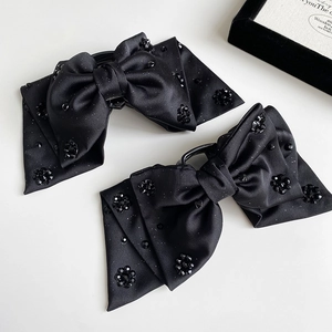 Elegant black satin bow hair clips set with shimmering hand-sewn beads for women