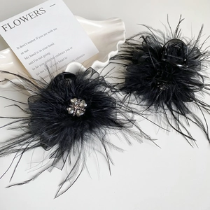 Elegant set of two black feather hair claws with mesh and sparkling clover rhinestones