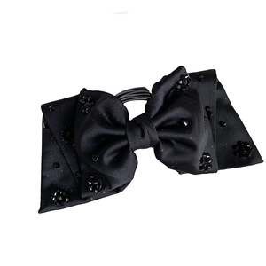 Elegant black satin bow hair clip with crystal beads and subtle silver sparkles for women