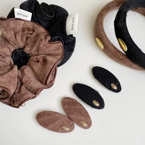 Vintage brown and black hair accessory set with fabric scrunchie and golden label hair clips