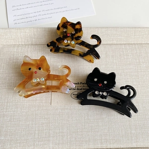 Trois pinces à cheveux chat en acétate avec strass en couleurs écaille et ambre