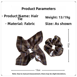 Detailed size and weight specs for the 13cm brown plaid fabric scrunchie with logo tag