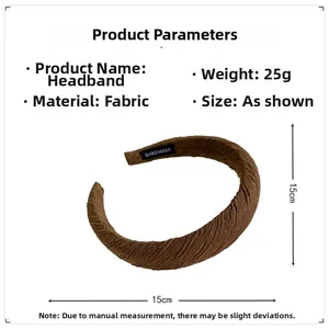Detail view of coffee pleated fabric headband with Handmade label and 15cm dimensions