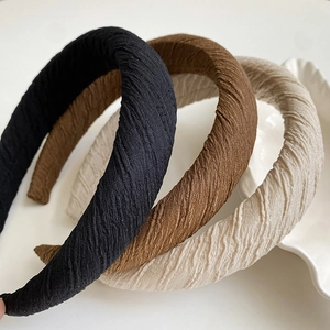 Three pleated thick sponge headbands in black, brown and beige for face washing and styling