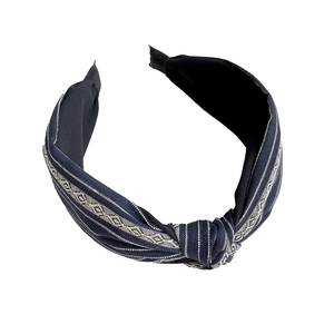 French retro navy blue striped headband with ethnic geometric pattern and center knot design