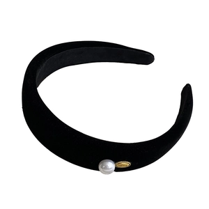 Elegant black velvet padded headband with white pearl and gold metal badge for women