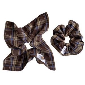 Plaid checkered fabric scrunchies set in brown and beige with a cute cartoon bear label