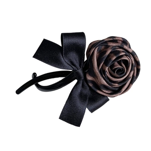 Vintage leopard print rose bow hair clip with black banana clip base for elegant women
