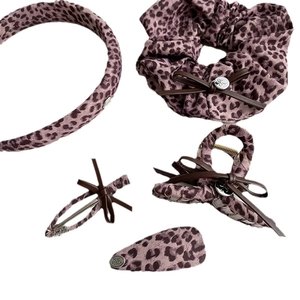 Pink leopard print hair accessories set with headband, scrunchie and bow hair clips