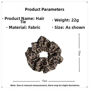 Detail showing 13cm diameter leopard print fabric scrunchie with 22g weight specification