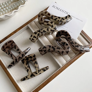 Set of four vintage leopard print hair claws in S-shape and geometric styles