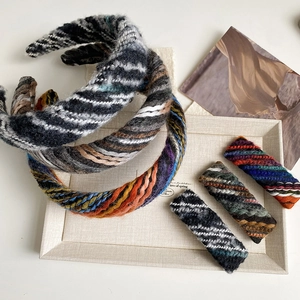 Detailed knit texture of handmade winter thick yarn headband and matching hair clips