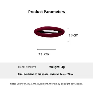 Detail shot of a wine red fabric hair clip with dimensions showing 7.2cm length and 2.3cm width
