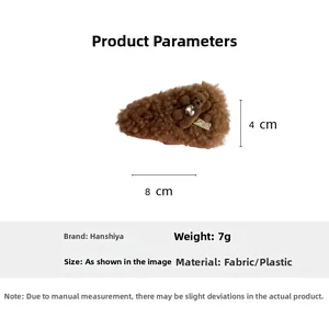Detailed view of a brown plush bear hair clip with dimensions 8cm by 4cm and weight 7g