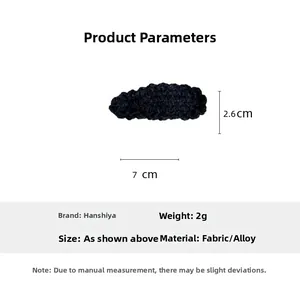 Detailed view of black wavy wool knit hair clip with size dimensions 7cm by 2.6cm