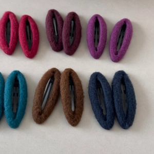 Detailed close-up of wool fabric teardrop BB hair clips in six assorted deep colors