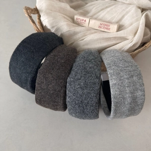 Set of four autumn winter wide knitted headbands in dark neutral colors for women