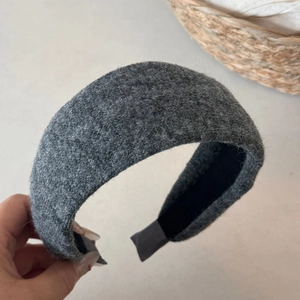 Close-up of the thick grey wool knit headband with non-slip lining and soft texture