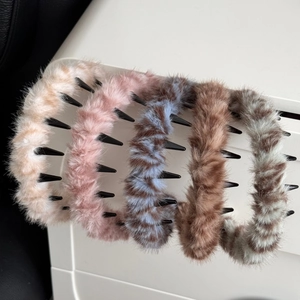 Close-up of five colorful plush headbands featuring soft faux fur texture and non-slip teeth