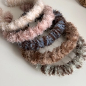 Detail showing five colors of plush wavy headbands with non-slip teeth for women