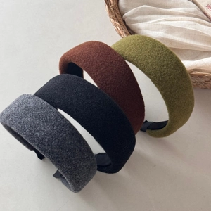 Detail of wool felt headbands in multiple colors featuring thick fiber texture and non-slip lining