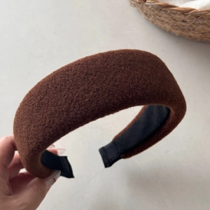 Detailed close-up of thickened coffee brown wool headband with soft sponge padding