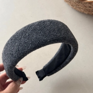 Detailed texture of thick dark grey wool headband with non-slip black lining
