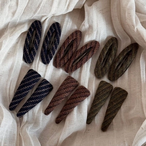 Vintage wool fabric hair clips in oval and triangle shapes for elegant autumn hairstyles