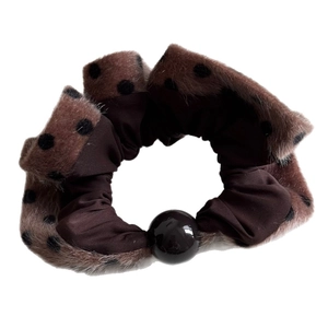 Plush brown polka dot scrunchie with a large pearl bead for high ponytail hairstyles