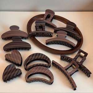 Brown striped pattern hair claw clips in various shapes like heart and square shapes